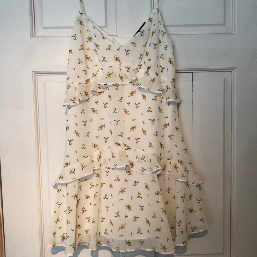 White short dress with yellow flowers